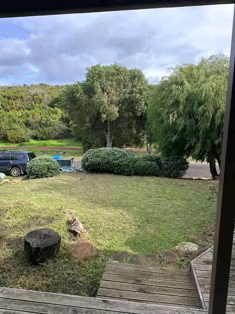 Trimmed hedges and rock wall along a Margaret River street (7 of 9)